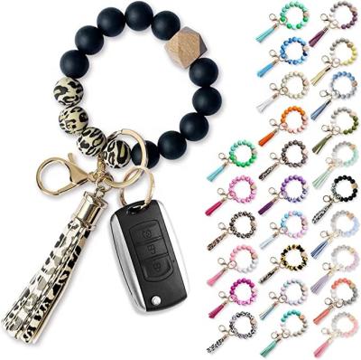 China New DNG Colorful Leopard Print Silicone Beads 15mm Dog Tassel Keychain Bracelet Loose Plaid 15mm Key Chain With Wooden Dangling Valentine for sale