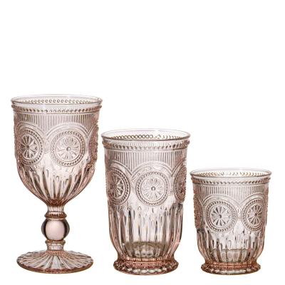 China Clear Amazon Hot Selling Colored Wine Glass Sunflower Embossed Decoration Pressed Wine Glass Set for sale