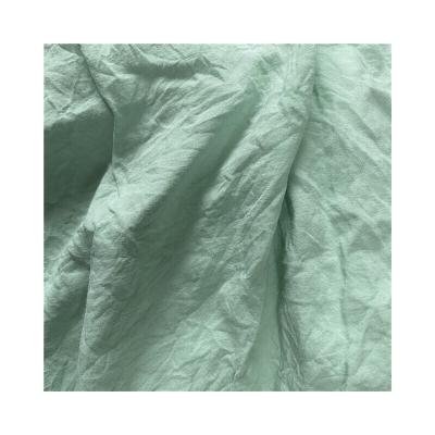 China Changxing Pleated Fabric 100gsm Waterproof Soft Polyester Washing Dyed Fabric for sale