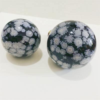 China Europe Bulk Wholesale Hand Carved Natural Snowflake Obsidian Ball Quartz Crystal Sphere for sale