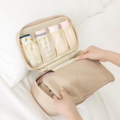 China Custom Viable Logo Folding Underwear Storage Bag With Handle Bra Storage Bag Travel Bag for sale