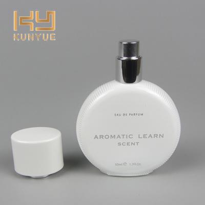 China New Personal Care Inventions 50ml Round Glass Perfume Bottle With Spray for sale