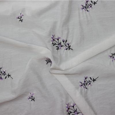 China Hot selling purple anti pill flower pattern embroidery fabrics, wholesale embroidered fabric for clothing for sale