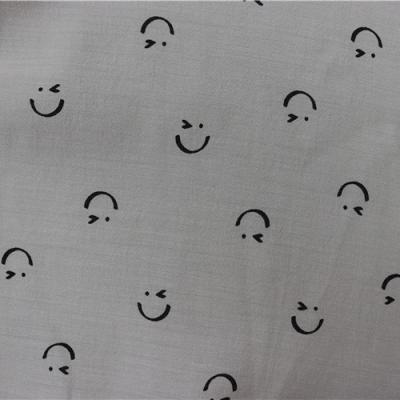 China New Selling Smiley Wink Pattern Printing 75% Anti Pill Black Rayon 25% Polyester Multicolor Printing Durable Fabric for sale