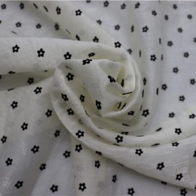 China Unique Design Anti Pill Hollow Out Flower Pattern Garment Fabric Textile Raw Material Fabric for sale