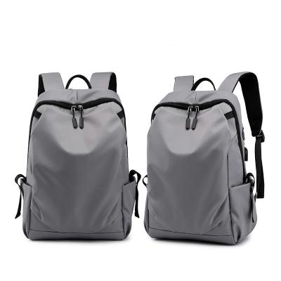 China 2021 New Large Capacity USB Computer Bag USB Earphone Hole Charging Backpack Fashion Backpack for sale