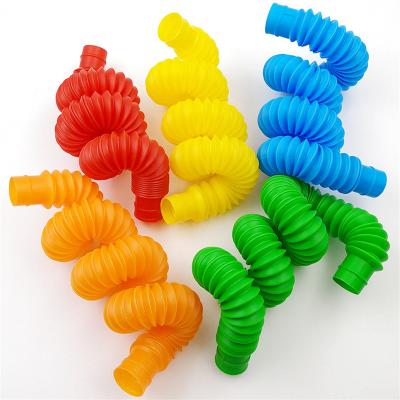 China Education Toys / Stir Toys / To Relieve To Stress Wholesale Plastic Stretched Pipe Squeeze Toys Telescopic Bellows Toy Pop Tubes Educational Toys For Kids for sale