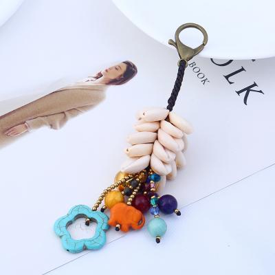 China YCK070 New Style Hand Woven Bell Shell Handwoven Bag Creative Pendant Key Accessories Chain Pendant Unisex Bohemian for sale