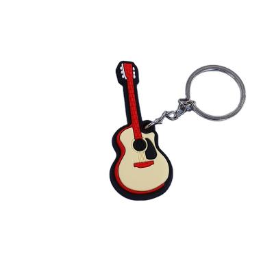 China Interesting Price Logo Rubber Ball Keychain Guitar Rubber Key Chain for sale