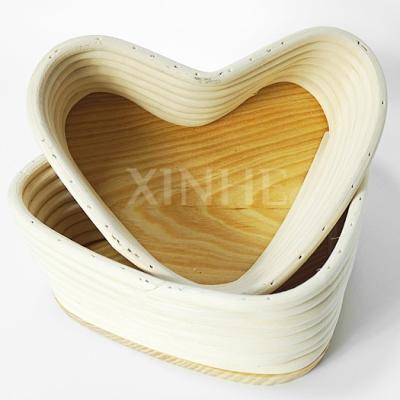 China Sustainable New Design Kitchen Natural Handwoven Amazon Rattan Heart Shape Bread Proofing Basket With Liner Baking Tools for sale