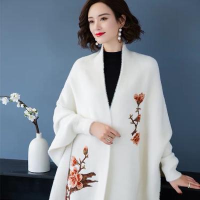 China 2022 Fashionable And Warm Flower Print Fringe Embroidery Winter Poncho Plush Shawl With Sleeves For Women for sale