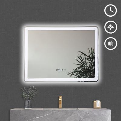 China Bright Customizable LED Lighting Display Time And Temperature Can Defog Rectangular Smart Bathroom Mirror for sale