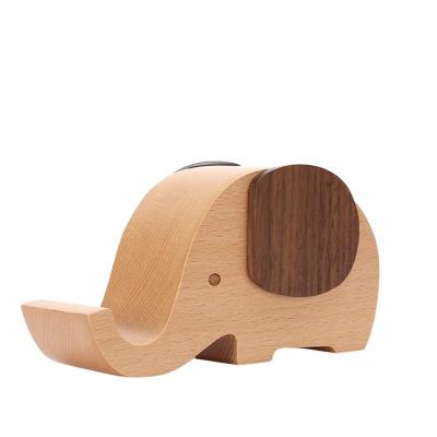 China Modern Simple Bamboo Cell Phone Stand Wood Made Elephant Phone Stand for Smartphone with Pen Holder Bamboo Desk Organizer for sale