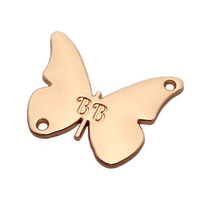 China Washable Personalized Gold Plated Metal Stamping Butterfly Logo Tag Label For Clothing for sale