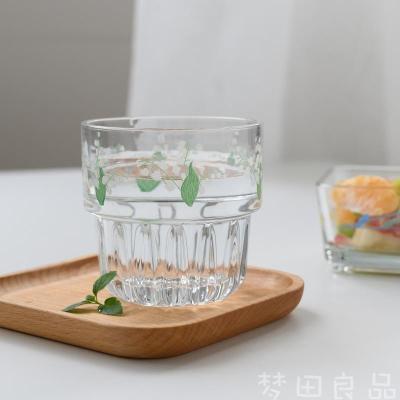 China High Temperature Resistance Small Face Flower Beverage Glass Cup Fruit Fresh Smile Transparent Cup for sale