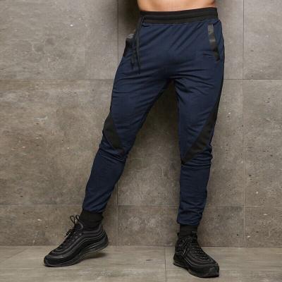 China Wholesale Antibacterial Quick Dry Mens Workout Joggers Pants Loose Trousers Antibacterial With Leg Zippers for sale