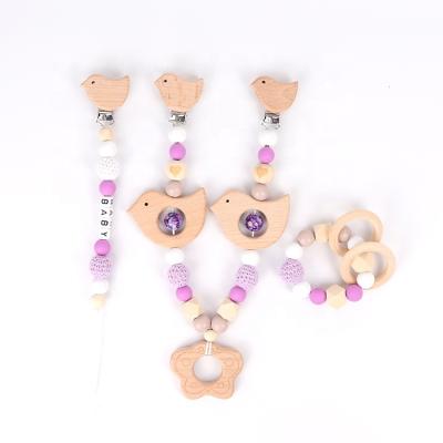 China Soft Toy Food Grade DIY Baby Teethers Chain Set With Round Engraved Wooden Trolley Chain Pacifier Chain Bracelet Set for sale