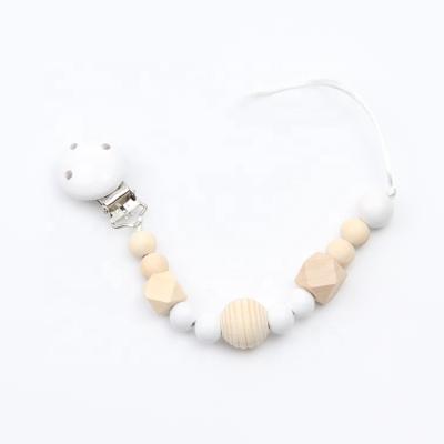 China Toy Wholesale soft wooden beads color three-hole beaded custom silicone baby nipple clip for sale