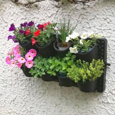 China Integrated Outdoor Vertical Planter Pot Plastic Self Watering Irrigation Planters Wall Hanging Green System for sale