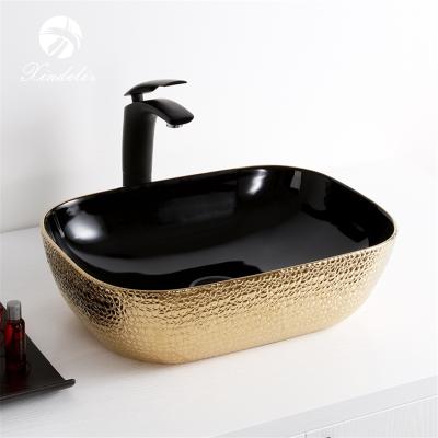 China Modern Hot Selling High End Black Gold Plated Bathroom Sinks Ceramic Wash Basin Lavabo for sale