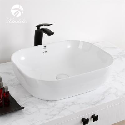 China XDL-D1302 Modern Unique Design White Color Over Counter Wash Ceramic Art Basin for sale