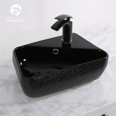 China Modern Unique Design XDL-D1108H004 Table Top Bathroom Sink Black Color Ceramic Wash Basin for sale