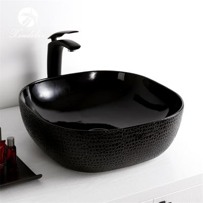 China XDL-D1301H004 Top Modern Design Bathroom Art Lavatory Black Ceramic High End Sinks The Wash Basin Price for sale