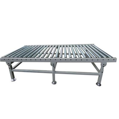 China Custom Gravity Powered Roller Conveyor Heavy Duty Machine Conveyor for sale