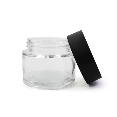 China Pharmaceutical Transparent 2OZ Oil Concentrate Packaging Glass Containers Glass Jars With Child Proof Lid for sale