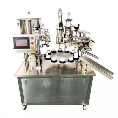 China Full Automatic Cigarettes Ice Cream Cone Lidding Filling Sealing Machine with Chocolate Spraying and Nut Adding Function for sale