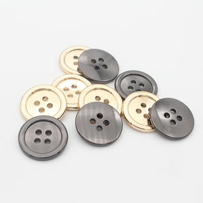 China Four-eye strong wear-resistant soft metal dry cleaning hardness high edge thin garment accessories sewing buckle coat button for sale