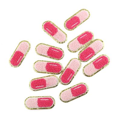 China New Self Adhesive Style Quilted Match Decoration Moq Pill Capsule Pattern Patch Ironed Low For Clothes Chenille Pill Patches for sale