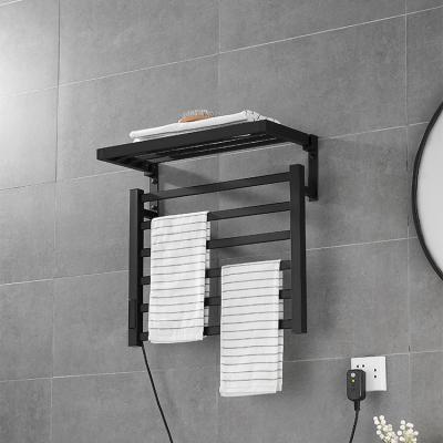 China Electric Towel Rack Matte Black Towel Rail Towel Heater Fashion Style Bathroom Stainless Steel Heater for sale