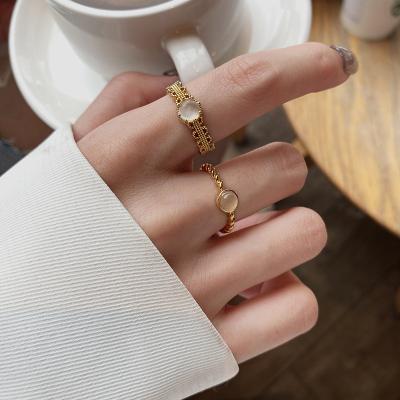 China Vintage Hot Sale Cheap Twist Ring Female Fashion Open Adjustable Gold Cats Stone Opal Ring for sale