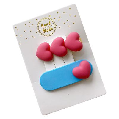 Chine Wholesale Sweet Color Cute Heart Candy Baby Kids Hairpin Side Decorative Clip Bangs Banana Hair Clips For Women à vendre