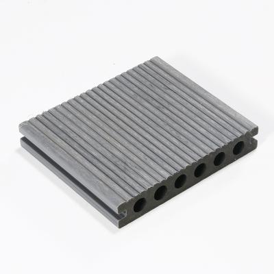 China Waterproof Round Hole Hollow Outdoor Garden Non Slip Wpc Plastic Composite Decking for sale