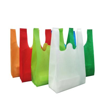 China Recyclable Eco-Friendly Low Price Non Woven Vest Tshirt Bag W-Cut Non-Woven T-Shirt Style Grocery Bag for sale