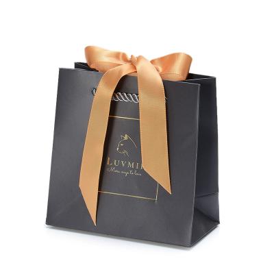 China Recycled Materials 2022 Hot Sale Stylish Customized Size Logo Paper Gift Shopping Bags With Ribbon Handles for sale