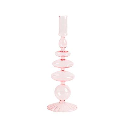 China Eco-friendly recyclable new design creative desktop ornament colored candles knock glass candle holder for home decor for sale