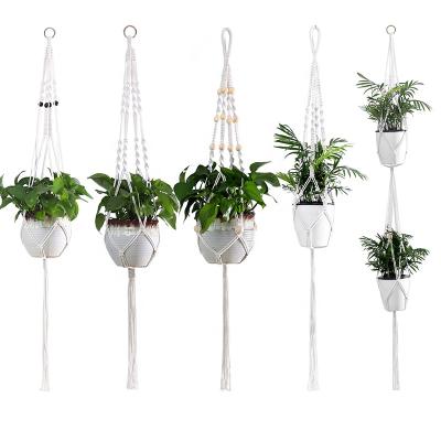 China MOQ Eco-Friendly Small Macrame Plant Hanger With Beads 4 Legs 4 Planter Basket Cotton Indoor Outdoor Hanging Rope For Plants for sale