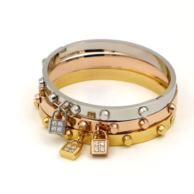 China Durable Lock Stainless Steel Bangle Gold Plated Studded Bracelet For Women for sale