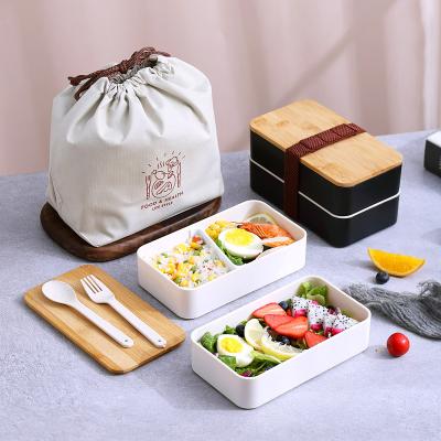 China Stainless Steel Food Storage Containers Stocked Lunch Box With Bamboo Lid And Cutlery Set For Kids for sale