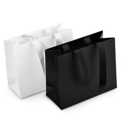 China RTS Recyclables 7 Days Make Your Own Bag Advertising Jewelry Luxury Clothing Gold Color Logo Paper Bag Black Printing for sale