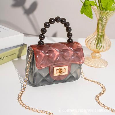 China Fashion PVC Girls Multicolor Jelly Handbags Kids Purse Pearl Handle Mini Transparent Cross Body Bag for sale