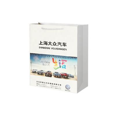 China Recyclable Wholesale Customization Luxury Sliver Handle White Packaging Paper Bags With Your Own Logo for sale