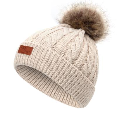 China COMMON Knit Leather Patch Winter Logo Beanie Hats Pom Pom Knitted Flip Cap Custom for sale