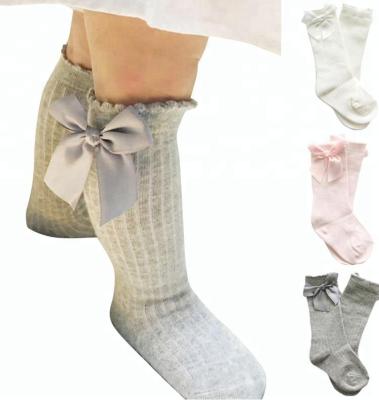 China Cute Anti-Fault Baby Bumps Infant Princess Socks Long Tube Infant High Booty Knee Bows Kids Vertical Striped Sock for sale