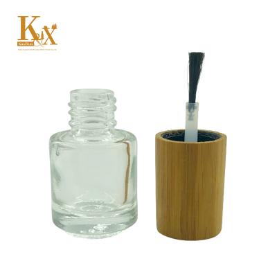 China Personal Care Biodegradable Bamboo Cosmetic Packaging Clear Glass Nail Polish Bottles With Bamboo Cap for sale