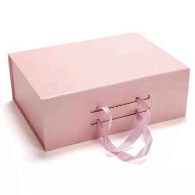 China Luxury design pink folding magnetic paper cardboard gift box jewelry packaging custom gift box with ribbon for sale