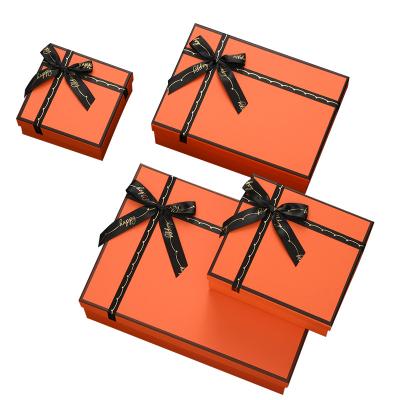 China Fancy Orange Gift Package Box With Black Ribbon Bow Recycled Materials for sale